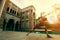 Woman posting warrior yoga pose beside sport water pool