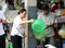 Woman pour the shrimp from basket into the plastic bag at fresh market in The Central Market, a large market with countless stalls