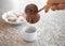 Woman pouring aromatic coffee into cup