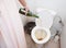 Woman pouring champagne in toilet