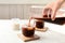 Woman pouring cold brew coffee into glass