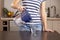 Woman pouring filtered water into a glass