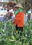 Woman is pouring flower on the street in Hanoi