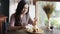 Woman pouring a fresh honey on the top of honey toast before eat