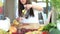 Woman pouring lemon juice into glass