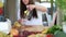 Woman pouring lemon juice into glass