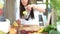 Woman pouring lemon juice into glass and drinking it