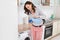 Woman Pouring Liquid Detergent In The Bottle Cap