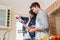 Woman pouring salt into utensil