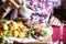 Woman Pouring Sauce on a Plate of Food