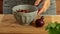 Woman pouring toscanian soup into bowl