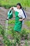 Woman pours green tomatoes