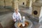 The woman pours water from a mineral source in Karlovy Vary