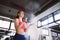 Woman powder hands before exercise in the gym