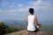 Woman practice yoga at mountain peak