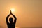 Woman practice yoga at sunrise seaside