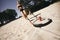 Woman practicing crossfit exercise on beach