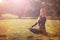 Woman practicing morning meditation in nature