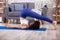 Woman Practicing Plow Pose On Yoga Mat