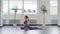 Woman practicing seated poses in yoga class