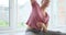 Woman practicing seated side bend yoga pose at fitness studio