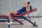 Woman practicing sit-ups on exercise machines