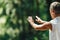 Woman Practicing Tai Chi Chuan Outdoors