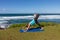 Woman Practicing Yoga along the Scenic Maui Coast