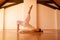 Woman practicing Yoga in a Attic