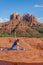 Woman Practicing Yoga at Cathedral Rocks Sedona Arizona