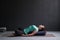 Woman practicing yoga concept, lying in Reclined Butterfly exercise