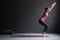 Woman practicing yoga, doing Chair exercise, Utkatasana pose, working out.