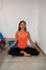 Woman practicing yoga at home