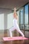 Woman Practicing Yoga On Mat