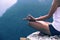 Woman practicing yoga at mountain peak