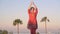 Woman practicing yoga outdoors during morning meditation.Peaceful Meditation in morning sunny day for good health.in