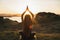 Woman practicing yoga outdoors. Spiritual harmony and well-being concept