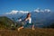 Woman practicing yoga, relaxing after riding bikes high in mount