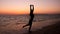 Woman practicing Yoga, sunset in the beach