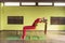 A woman practicing yoga therapy, performs a back bend, putting a mat under the lower back, trains sitting on a chair