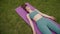 Woman practises yoga in forest. Girl meditates in nature outdoors. Fitness