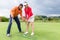 Woman practising with golf trainer