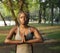 Woman practising yoga in a park