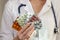 Woman practitioner holding blisters fan in hands