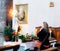 Woman praying at altar in church, Siena, Italy