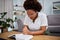 Woman, praying with bible and meditation in home, lounge and reading about Jesus, religion and worship for mindfulness