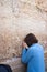 A woman prays at the Wailing Wall.