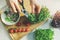 Woman prepare fresh raw vegetarian salad from microgreens and vegetables