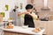 A woman prepares a dough for baking