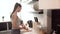 Woman Preparing Breakfast, Cutting Bread On Board In Kitchen